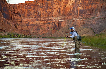 Man Fly Fishing On The Colorado River In The Grand Canyon