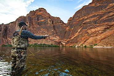 Man Fly Fishing During Sunset On The Colorado River In The Grand Canyon