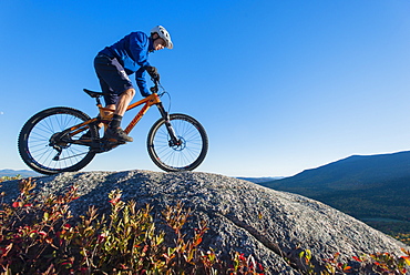 Mountain Biker Riding On The Rocky Landscape Of Whitehorse Ledge, New Hampshire