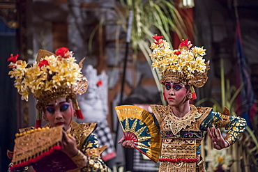 Traditional Balinese Legong Dancers Performing In A Theater In Ubud, Bali, Indonesia