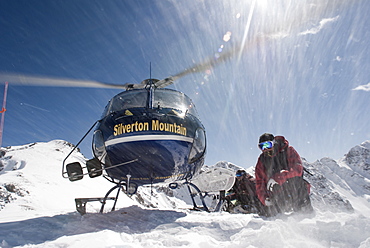 A Helicopter Taking Off After Dropping A Snowboarders In The San Juan Mountain Range