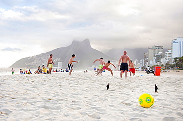 Group Of Men Playing Soccer On Ipanema Beach