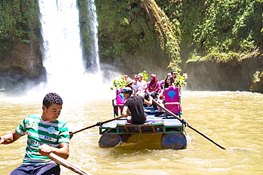 Boats Carry Tourists At The Cascades Douzoud Waterfall In The Atlas Mountains