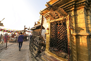 A Woman Completes Her Circumnavigation Of Swayambhunath Stupa In Early Morning Light