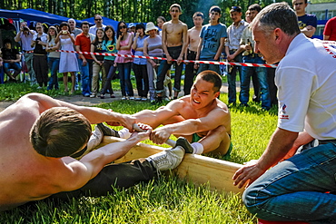 Boys Performing Mas-wrestling Game At City Park