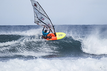 Professional Windsurfer On The Freezing Waters Of The Faroe Islands