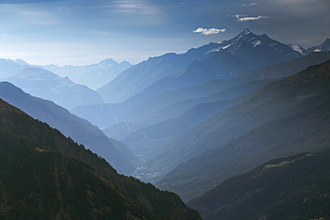 Mountain Ridges Of The Aosta Valley At Italy In The Morning Mist