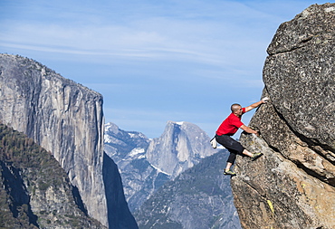 Male Climber In Yosemite With El Capitan And Half Dome In Background