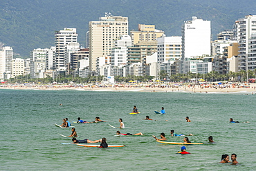 Surfers In Ipanema Beach, Rio De Janeiro, Brazil