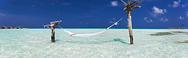 Hammock hanging above sea at Gili Lankanfushi island