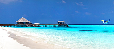 Tropical resort with stilt huts in sea