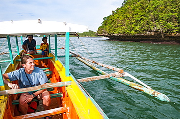 Woman Riding On Boat Through Hundred Islands National Park, Luzon, Philippines