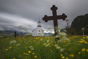 Flower filled cemetery at Gimsøy church, Gimsøy, Lofoten Islands, Norway