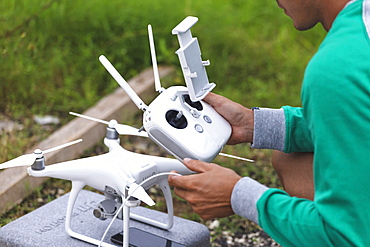 Man holding drone remote control