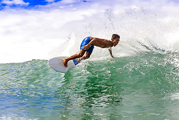 Young man surfing