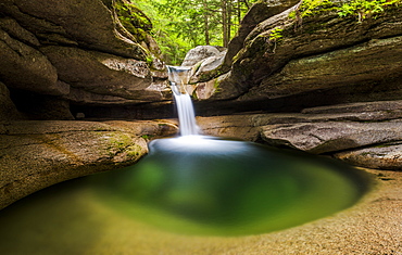 An emerald green pool at the top of Sabbady Falls in New Hampshire.