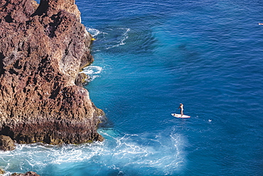 SUP girl enjoying in a beautiful sea