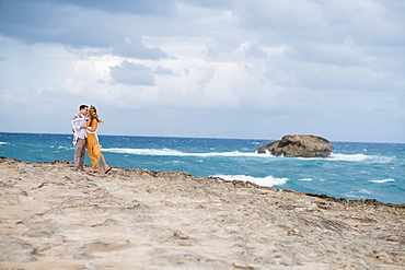 Engaged couple portrait on the beach at North Shore Oahu Hawaii in the Spring.