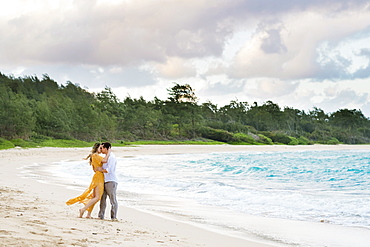 Engaged couple portrait on the beach at North Shore Oahu Hawaii in the Spring.