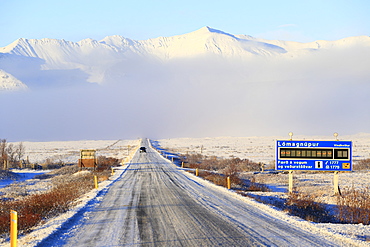 Route 1 road and road weather information sign at Skaftafell, southeast Iceland in winter