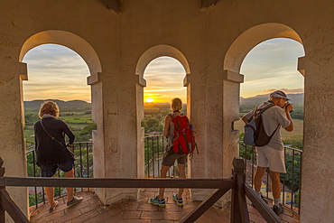 Three Toursits enjoy the view of Valle do los Ingenios from lookout tower