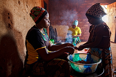 Mforo, Tanzania a village near Moshi, Tanzania. Solar Sister entrepreneur Fatma Mziray and her eldest daughter Zainabu Ramadhani, 19 cook lunch in her kitchen house using both a clean cookstove using wood and one using coal.  One of her younger daughters, Nasma Ramadhani, age 5 helps out.                                                                     Fatma Mziray is a Solar Sister entrepreneur who sells both clean cookstoves and solar lanterns. Fatma heard about the cookstoves from a Solar Sister development associate and decided to try one out. The smoke from cooking on her traditional wood stove using firewood was causing her to have a lot of heath problems, her lungs congested her eyes stinging and her doctor told her that she had to stop cooking that way. Some days she felt so bad she couldn't go in to cook. Fatma said, âCooking for a family, preparing breakfast, lunch and dinner I used to gather a large load of wood every day to use. Now with the new cook stove the same load of wood can last up to three weeks of cooking.   âWith the extra time I can develop my business. I also have more time for the family. I can monitor my childrenâs studies. All of this makes for a happier family and a better relationship with my husband. Since using the clean cookstove no one has been sick or gone to the hospital due to flu.â  Fatma sees herself helping her community because she no longer sees the people that she has sold cookstoves have red eyes, coughing or sick like they used to be. She has been able to help with the school fees for her children, purchase items for the home and a cow.  âWhat makes me wake up early every morning and take my cookstoves and go to my business is to be able to take my family to school as well as to get food and other family needs.â