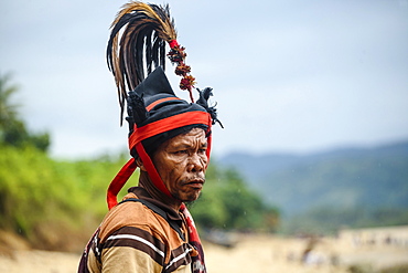 Man wearing hat and traditional costume, Pasola festival, Sumba Island, Indonesia