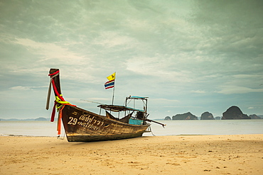 Long-tail boat moored on beach during daytime, Krabi, Krabi Province, Thailand