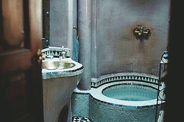 Details of Arabian bathroom with sink and bathtub, Marrakech, Morocco