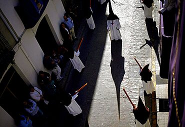 Shadow of penitente during Easter Week celebrations in Baeza, Jaen Province, Andalusia, Spain