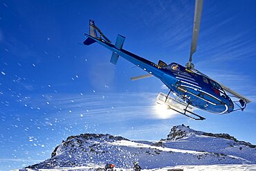 Skiers doing heliskiing in Formazza Valley, Piedmont, Italy