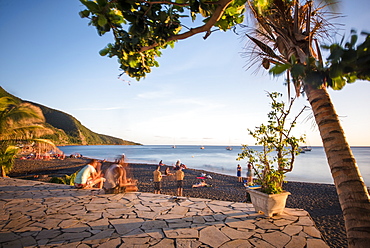 Long exposure shot of group of tourists at Black Sand Beach, Basse Terre, Guadeloupe