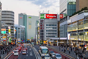 Street scene with traffic and pedestrians in the Shinjuku district of Tokyo, Japan