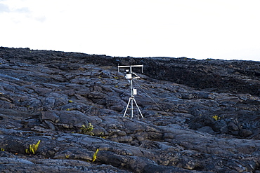 Weather station collecting data for the national park and weather service planted on old lava flows in Hawaii Volcanoes National Park