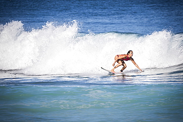 Full length shot of woman surfing in sea