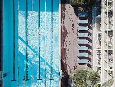 Aerial view of swimmers in hotel swimming pool, Mallorca, Balearic Islands, Spain