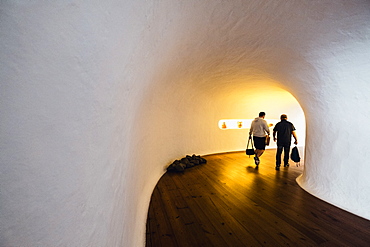 Men walking through corridor in Mirador del Rio by Cesar Manrique, Lanzarote, Spain