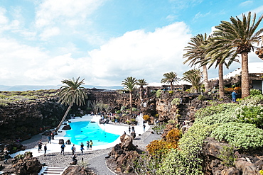 Landscape with rocky mountains and pool with turquoise water at Jameos del Agua, Lanzarote, Spain