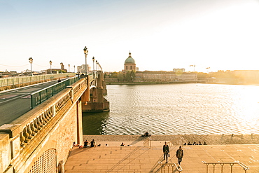 Saint-Pierre bridge with Chapelle Saint-Joseph de la Grave on the background before sunset, Toulouse, Occitanie, France