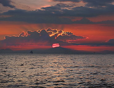 Distant view of silhouette of sailboat in sea at sunset, Boracay, Aklan, Philippines