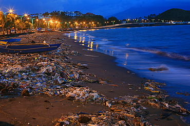 Polluted beach with trash at night, Legazpi City, Albay Province, Philippines