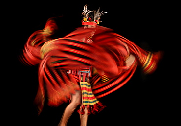 Ifugao tribesman dancing against black background, Banaue, Ifugao, Philippines