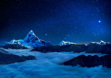 Landscape with starry sky over sea of clouds and snowcapped mountains, Pokhara, Kaski, Nepal