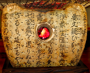 Steak on stone oven with inscriptions in Japanese restaurant, Tokyo, Japan