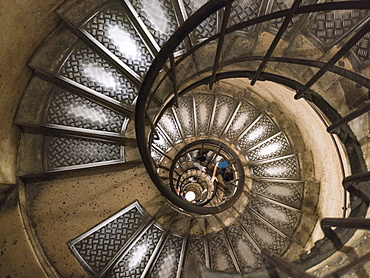 View down spiral staircase in Triumphal Arch, Paris, France