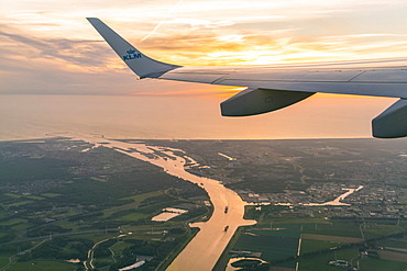 Sunset over Amsterdam from viewed from airplane, Amsterdam, Netherlands