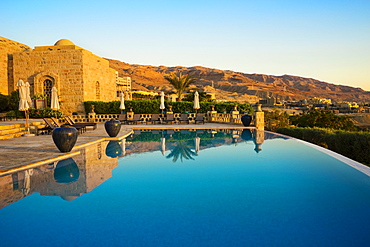 View of infinity pool in resort near Dead Sea under clear sky, Madaba Governorate, Jordan