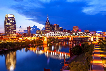 Twilight view of Nashville skyline looking across Cumberland River to central business district, Nashville, Tennessee, USA