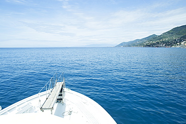 Seascape with boatÂ tip overlooking picturesque coastline, Â Portofino, Â Liguria, Italy