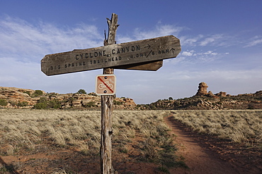 View of trail post with no bikes allowed sign inÂ CanyonlandsÂ National Park, Utah, USA